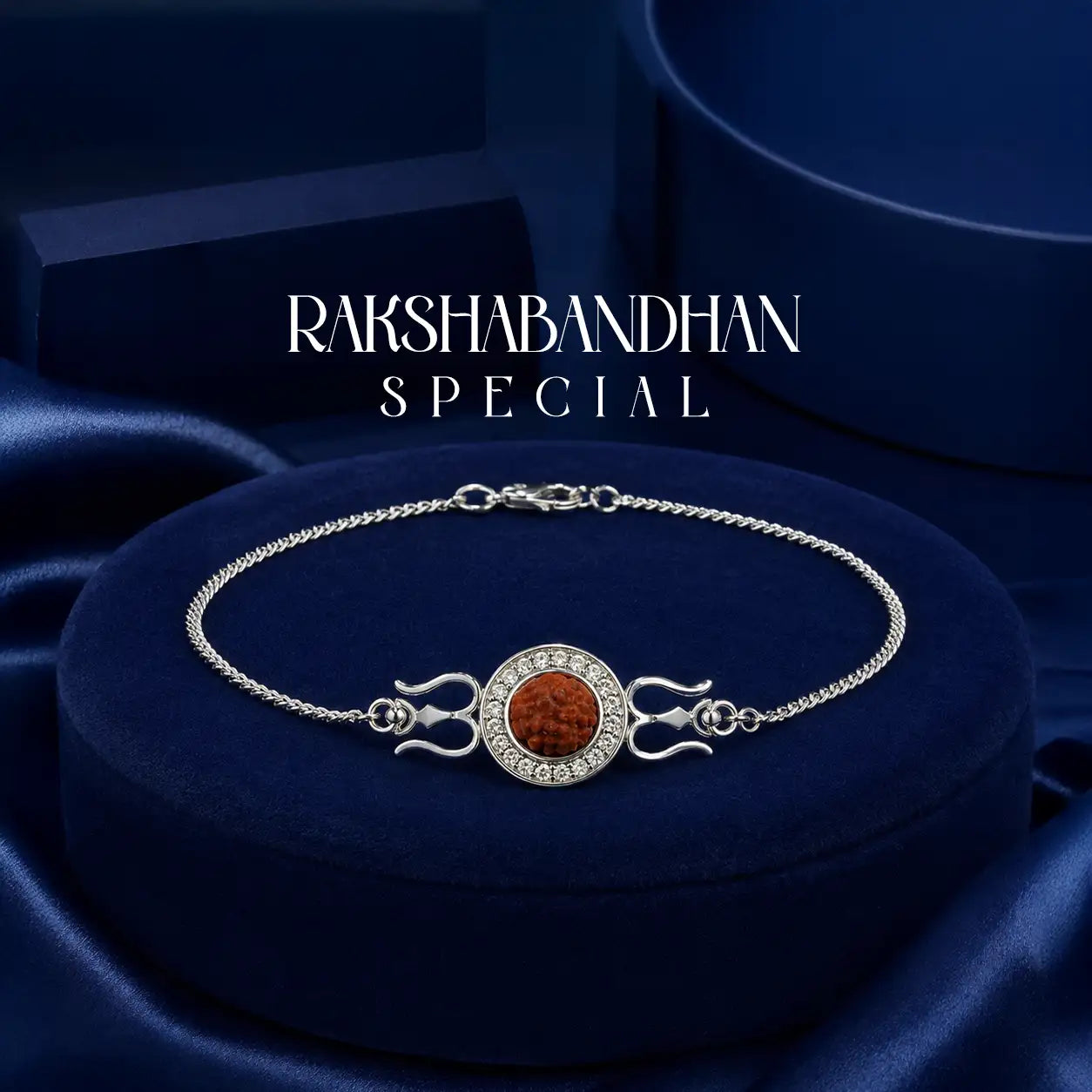 Silver bracelet featuring a central orange gemstone encircled by clear crystals and flanked by two stylized trident motifs.